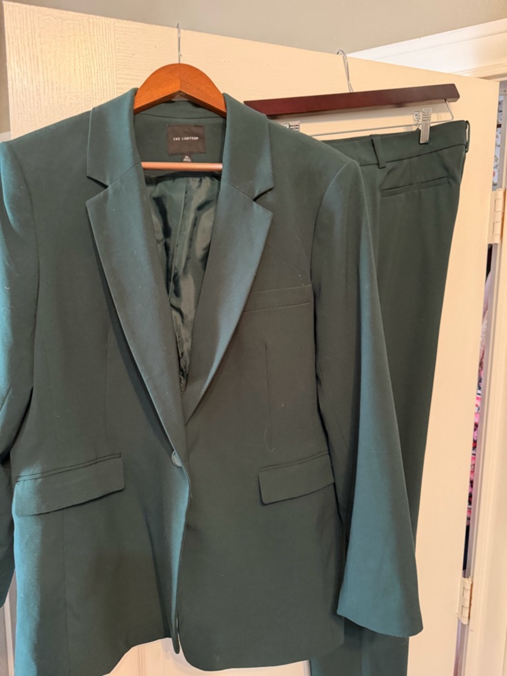 The Limited Women’sForest Green Suit . The Blazer is XL the pants are size 8.
